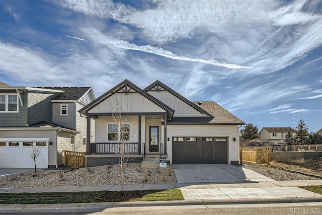 view of front of property with covered porch and a garage