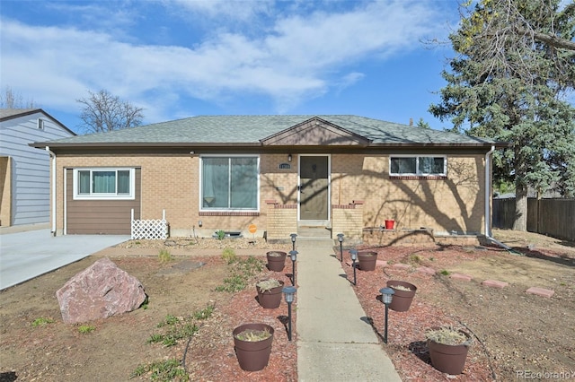 11360 Irma Dr, Northglenn, CO 80233 - view of front facade featuring brick siding, entry steps, and a shingled roof