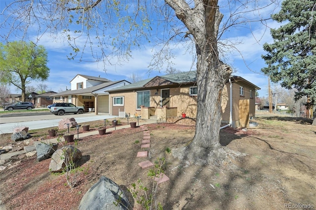11360 Irma Dr, Northglenn, CO 80233 - view of front facade with driveway and brick siding