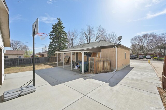 11360 Irma Dr, Northglenn, CO 80233 - back of property with a patio and brick siding