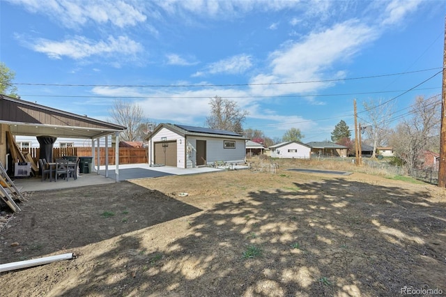 11360 Irma Dr, Northglenn, CO 80233 - view of yard with a patio area, an outdoor structure, and a garage
