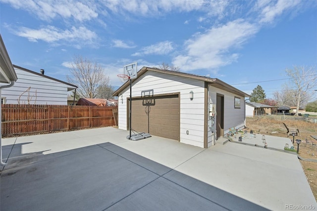 11360 Irma Dr, Northglenn, CO 80233 - view of patio / terrace featuring a detached garage, an outdoor structure, and concrete driveway