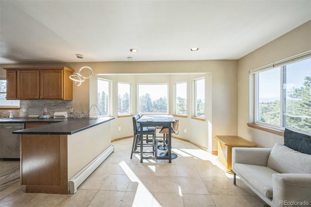 kitchen with dishwasher, a baseboard radiator, kitchen peninsula, decorative backsplash, and light tile patterned flooring