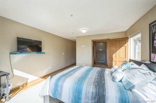 bedroom with hardwood / wood-style floors