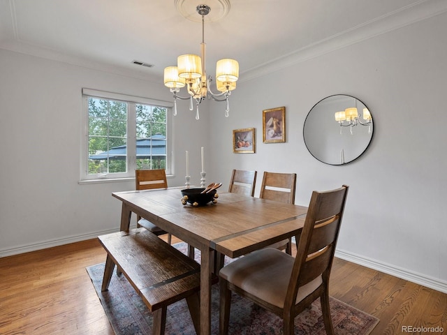 405 S University Blvd, Denver, CO 80209 - dining room featuring a chandelier, baseboards, light wood-style floors, and ornamental molding