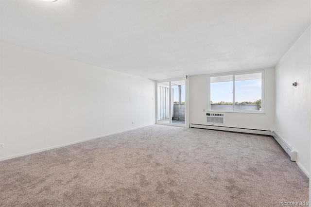 1029 E 8th Ave Unit 603, Denver, CO 80218 - carpeted spare room featuring a wall mounted air conditioner and baseboards