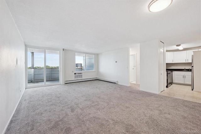 1029 E 8th Ave Unit 603, Denver, CO 80218 - unfurnished living room featuring a baseboard radiator and light carpet