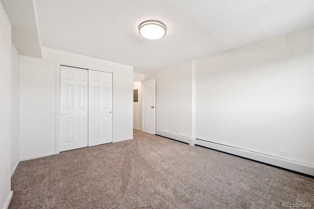 1029 E 8th Ave Unit 603, Denver, CO 80218 - unfurnished bedroom featuring carpet flooring, a textured ceiling, and a closet