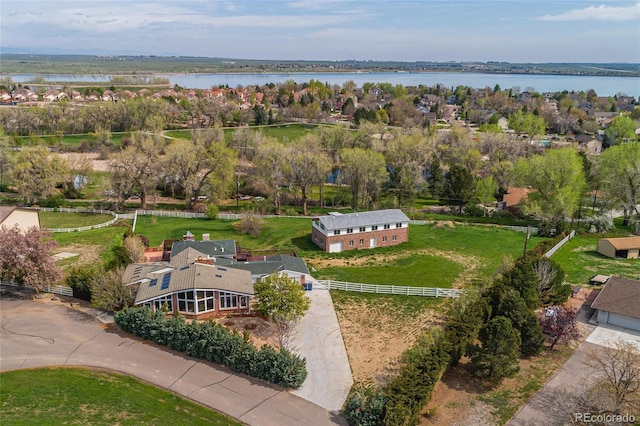birds eye view of property featuring a water view and a residential view