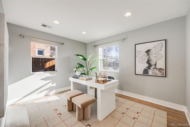 home office with light wood finished floors, baseboards, visible vents, and recessed lighting