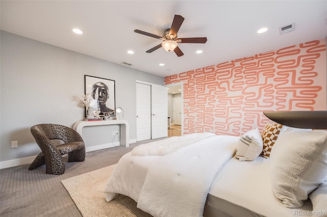 carpeted bedroom with visible vents, baseboards, and recessed lighting