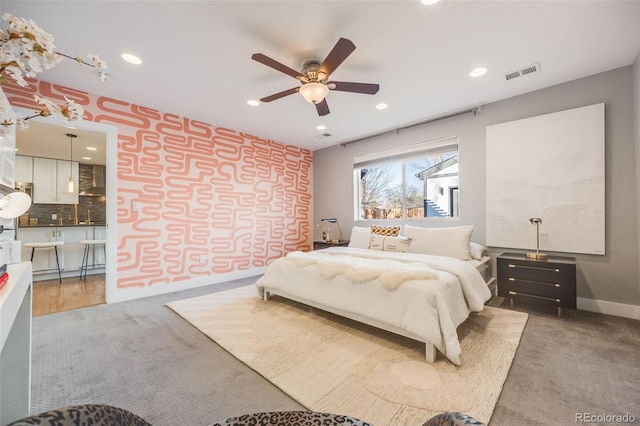 bedroom with recessed lighting, baseboards, visible vents, and light colored carpet