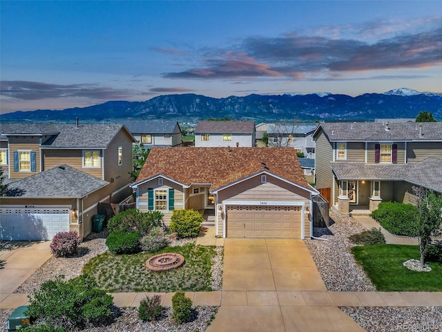 3456 Osprey Ridge Dr, Colorado Springs, CO 80916 - traditional-style home with a mountain view, driveway, a residential view, and a garage