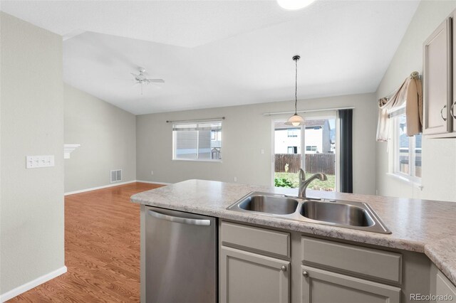 3456 Osprey Ridge Dr, Colorado Springs, CO 80916 - kitchen featuring stainless steel dishwasher, a sink, ceiling fan, light wood finished floors, and light countertops