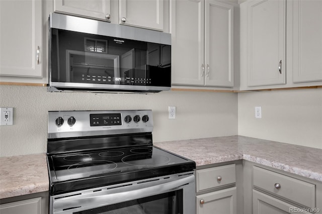 3456 Osprey Ridge Dr, Colorado Springs, CO 80916 - kitchen featuring appliances with stainless steel finishes and light countertops