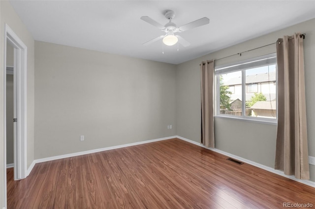 3456 Osprey Ridge Dr, Colorado Springs, CO 80916 - unfurnished room featuring wood finished floors, a ceiling fan, and baseboards