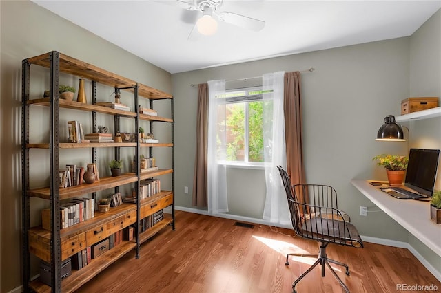 3456 Osprey Ridge Dr, Colorado Springs, CO 80916 - home office with wood finished floors, ceiling fan, and baseboards