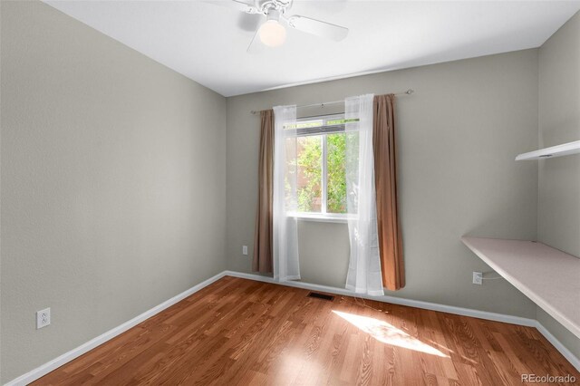 3456 Osprey Ridge Dr, Colorado Springs, CO 80916 - spare room featuring wood finished floors, ceiling fan, and baseboards