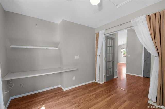 3456 Osprey Ridge Dr, Colorado Springs, CO 80916 - unfurnished room with wood finished floors, baseboards, and ceiling fan