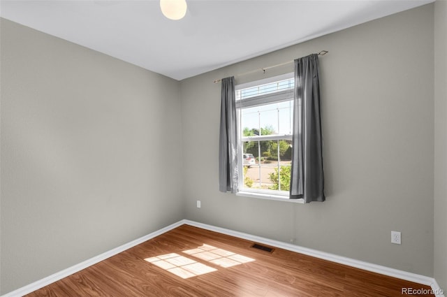 3456 Osprey Ridge Dr, Colorado Springs, CO 80916 - empty room with wood finished floors and baseboards