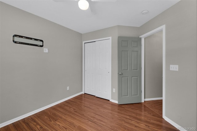 3456 Osprey Ridge Dr, Colorado Springs, CO 80916 - unfurnished bedroom with wood finished floors, a closet, baseboards, and ceiling fan