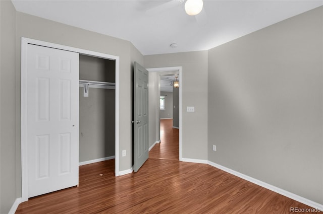3456 Osprey Ridge Dr, Colorado Springs, CO 80916 - unfurnished bedroom featuring wood finished floors, baseboards, a closet, and a ceiling fan