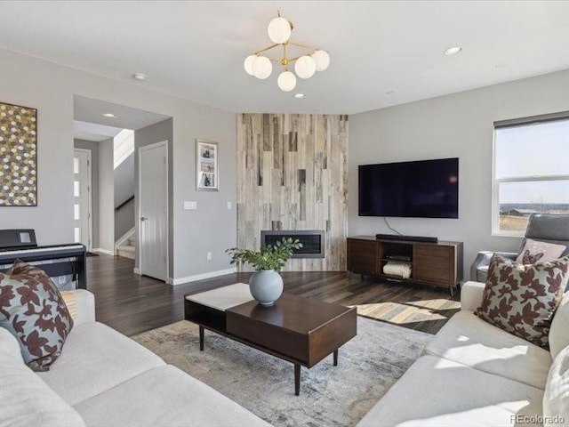 11426 Box Turtle Ct, Parker, CO 80134 - living area featuring wood finished floors, stairway, baseboards, recessed lighting, and a chandelier