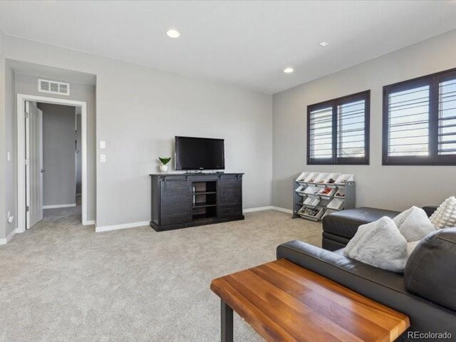 11426 Box Turtle Ct, Parker, CO 80134 - carpeted living room featuring baseboards and recessed lighting