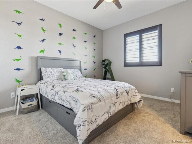 11426 Box Turtle Ct, Parker, CO 80134 - bedroom with carpet floors, baseboards, and ceiling fan