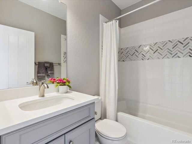 11426 Box Turtle Ct, Parker, CO 80134 - bathroom with vanity, shower / bath combo, and toilet