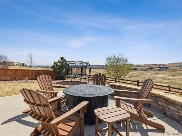 11426 Box Turtle Ct, Parker, CO 80134 - view of patio with a trampoline