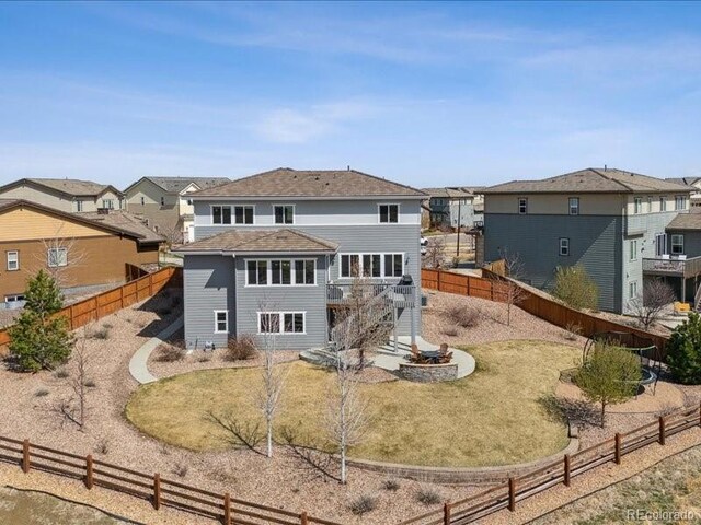 11426 Box Turtle Ct, Parker, CO 80134 - back of property featuring stairway, a wooden deck, a fenced backyard, and a residential view