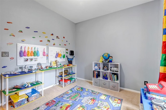rec room featuring carpet and baseboards
