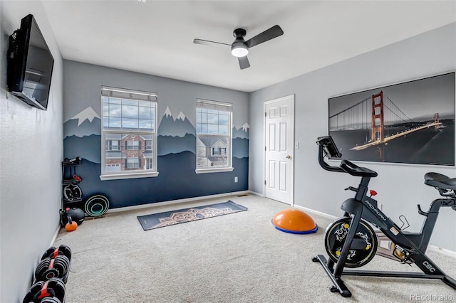 workout room featuring carpet flooring, a ceiling fan, and baseboards