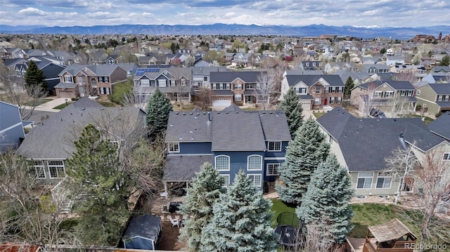 drone / aerial view featuring a mountain view and a residential view