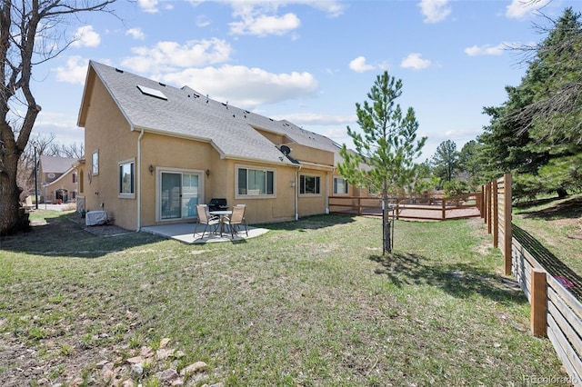 1890 Bel Lago Vw, Monument, CO 80132 - rear view of property featuring a patio area, stucco siding, and a shingled roof