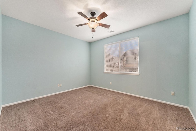 unfurnished room featuring a textured ceiling, ceiling fan, and carpet flooring