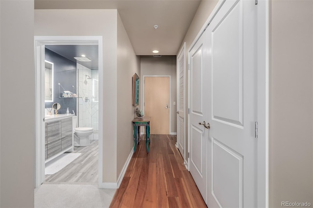 1700 Bassett St Unit 513, Denver, CO 80202 - hall with wood finished floors, baseboards, and recessed lighting