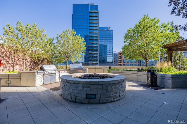 1700 Bassett St Unit 513, Denver, CO 80202 - view of patio with area for grilling, a fire pit, and a view of city