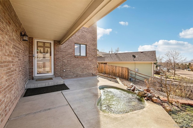 view of patio / terrace featuring fence