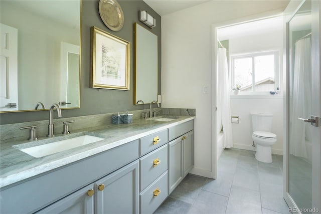 full bath with double vanity, tile patterned flooring, a shower with curtain, and a sink