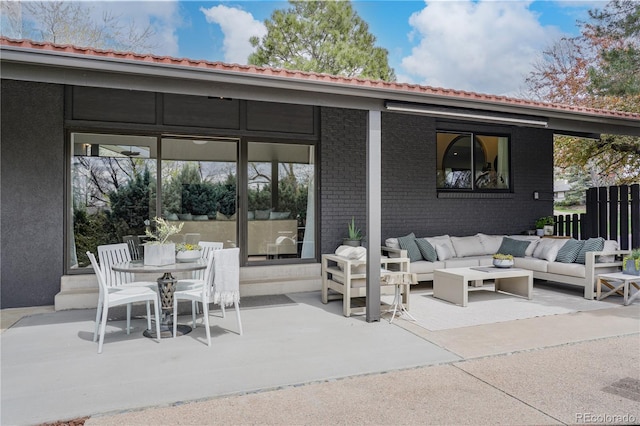 view of patio / terrace featuring an outdoor hangout area and outdoor dining space