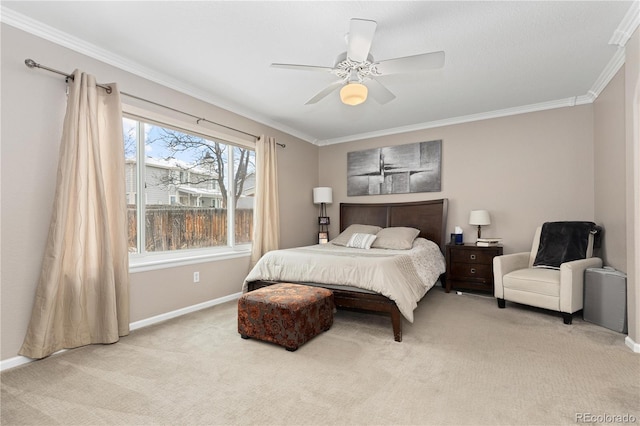 carpeted bedroom with crown molding and ceiling fan