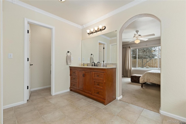 bathroom featuring crown molding, vanity, and ceiling fan