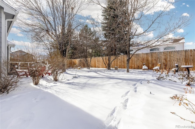 view of yard covered in snow