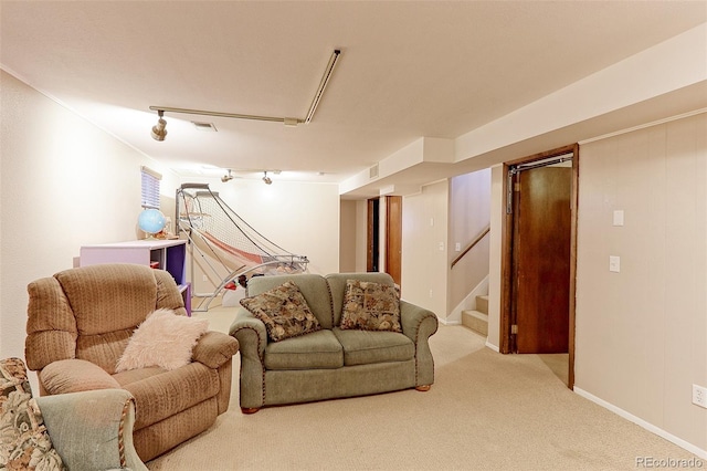 living area featuring stairway, carpet flooring, and baseboards