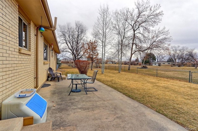 view of patio featuring fence