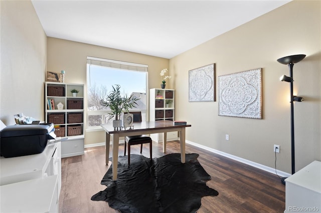 office area featuring baseboards and wood finished floors