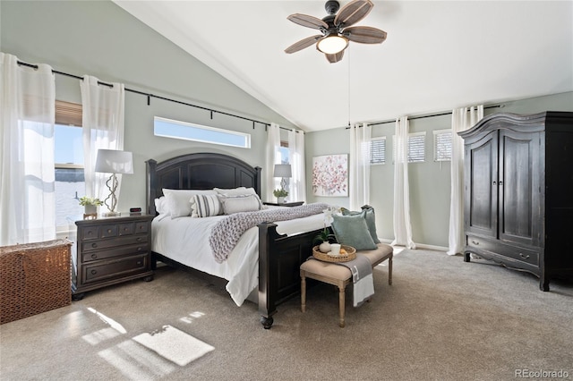 bedroom featuring lofted ceiling, carpet, and a ceiling fan