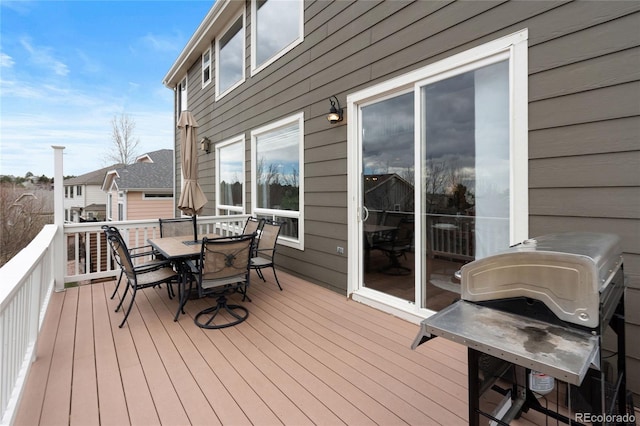 wooden deck featuring outdoor dining space